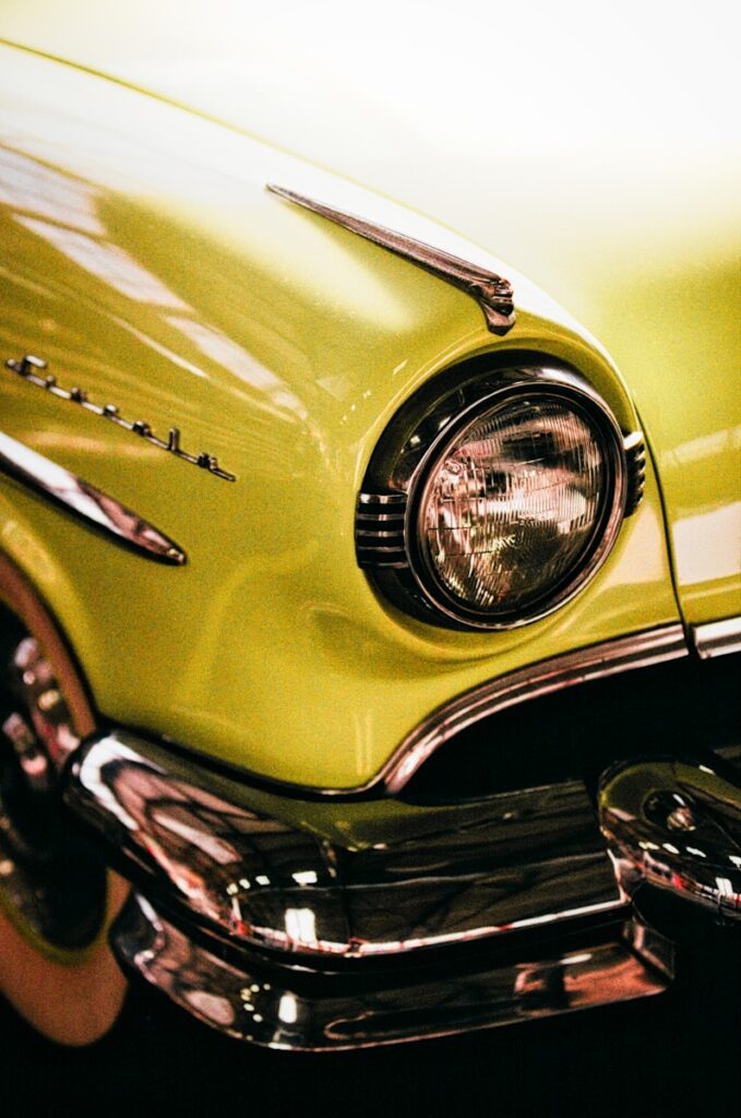 Close-up of a vintage yellow car headlight